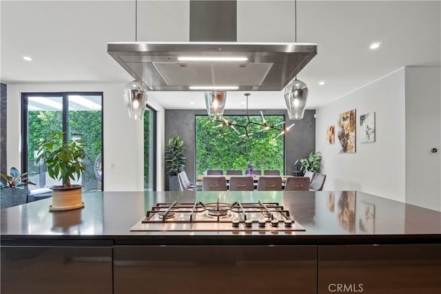 kitchen featuring island exhaust hood and stainless steel gas stovetop