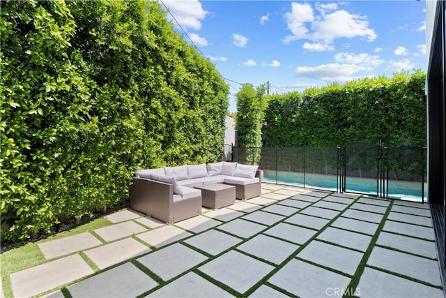 view of patio / terrace with a fenced in pool and an outdoor living space