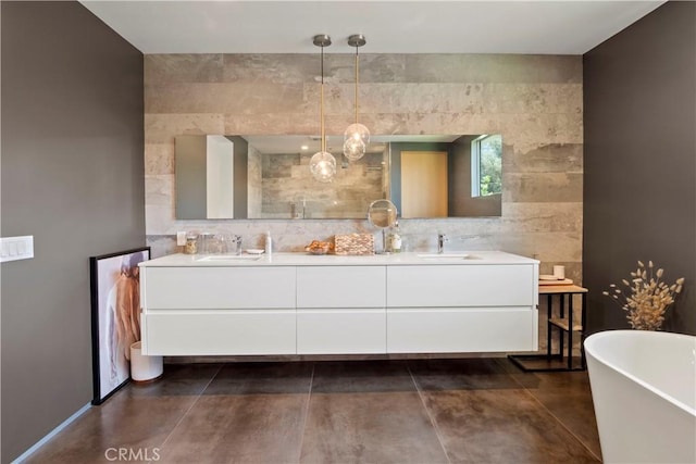 bathroom featuring a washtub, vanity, and tile walls