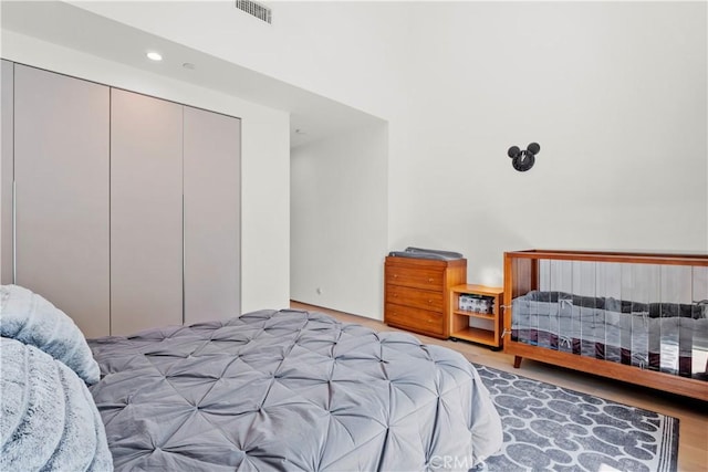 bedroom featuring a closet and light hardwood / wood-style floors