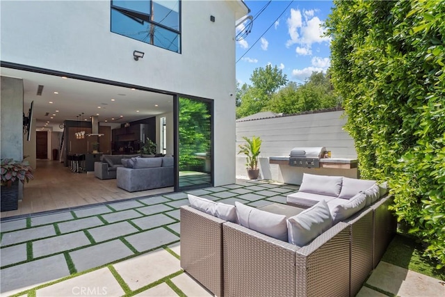 view of patio / terrace featuring an outdoor living space and a grill