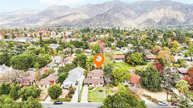 drone / aerial view featuring a mountain view