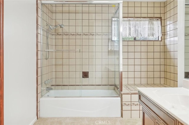 bathroom with shower / bath combination with glass door, vanity, and tile patterned floors