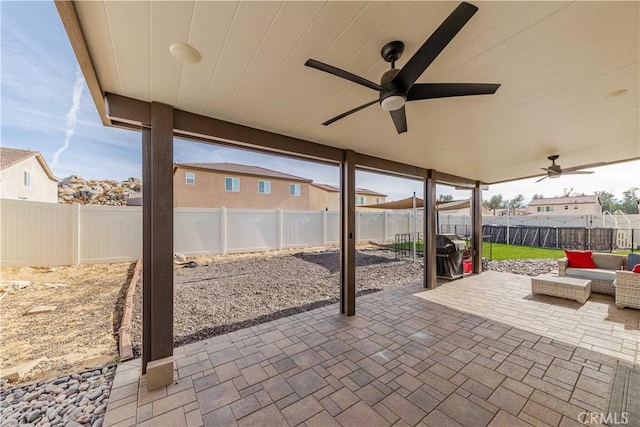 view of patio featuring ceiling fan and grilling area