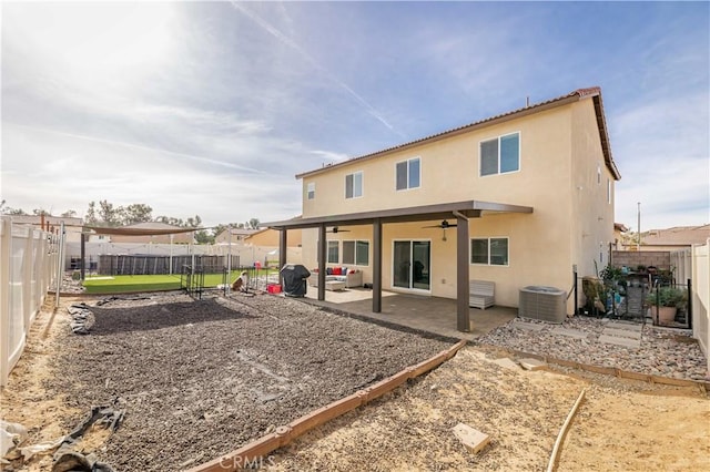 back of house with central AC, ceiling fan, and a patio area