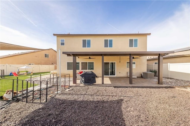 back of property with ceiling fan, a patio, and central AC