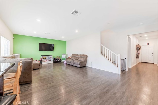 living room with dark hardwood / wood-style flooring