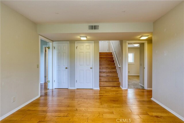 spare room featuring light hardwood / wood-style flooring