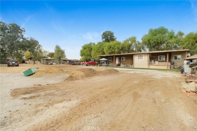 exterior space with a carport