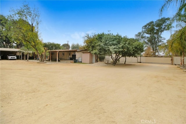 view of yard with a carport