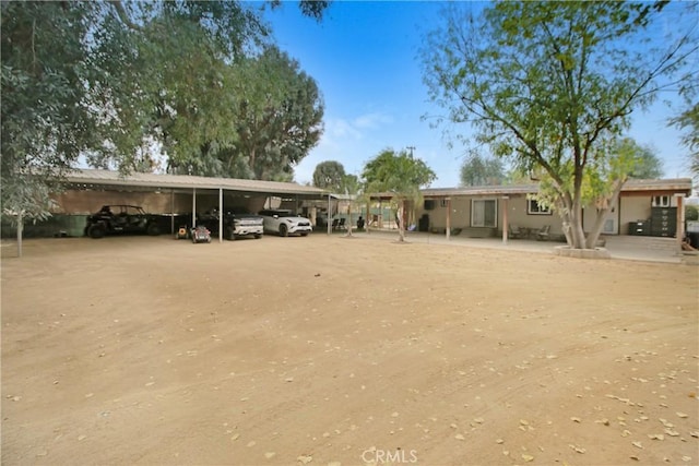 view of parking with a carport