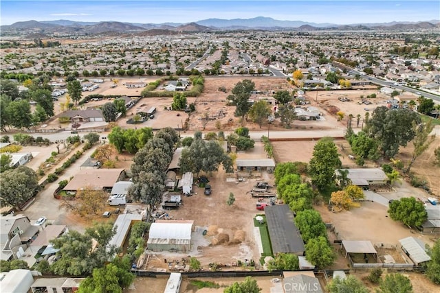 birds eye view of property with a mountain view