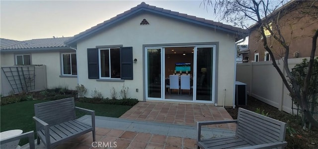 back of house with a patio