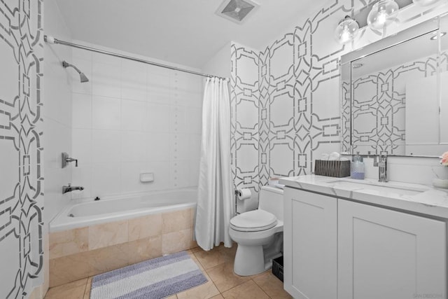 full bathroom with tile patterned flooring, vanity, shower / tub combo, and toilet