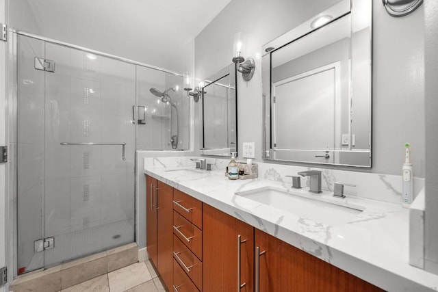 bathroom featuring tile patterned floors, vanity, and walk in shower