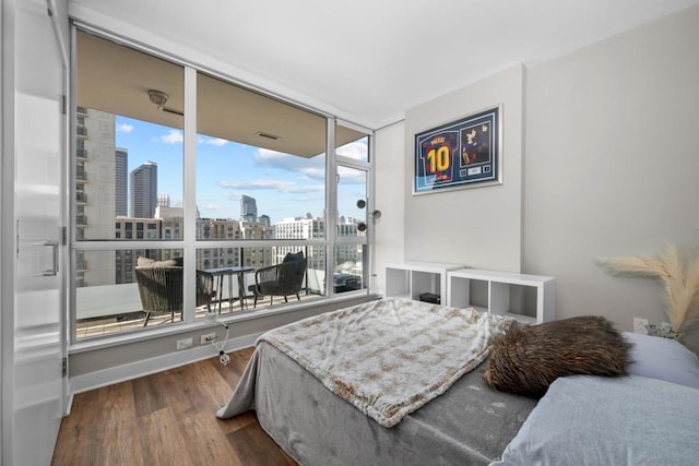 bedroom with hardwood / wood-style floors