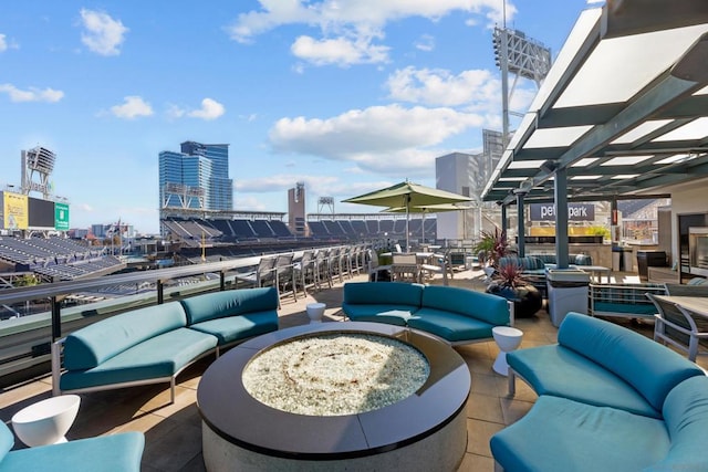 view of patio / terrace featuring a bar and an outdoor living space