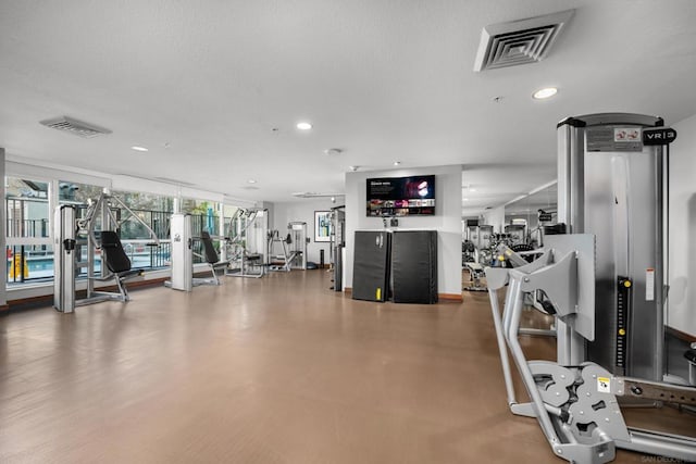 exercise room featuring a textured ceiling