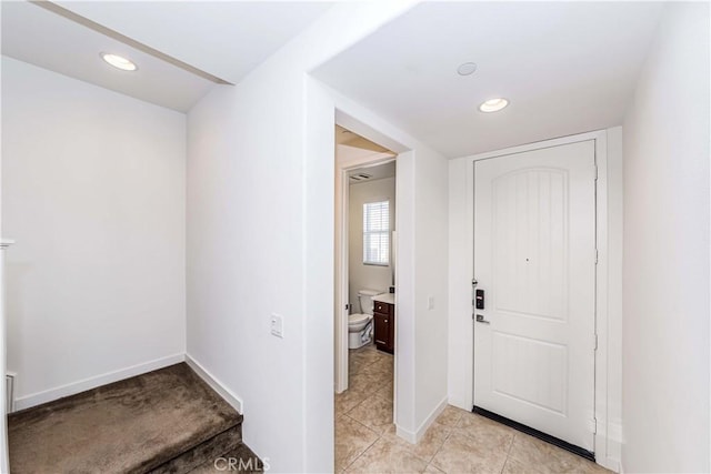 view of tiled foyer entrance