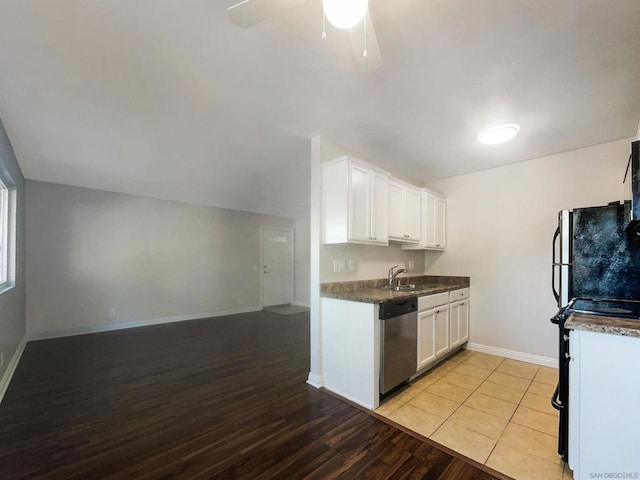 kitchen with sink, stainless steel dishwasher, ceiling fan, light tile patterned flooring, and white cabinetry