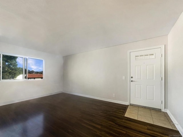 entryway with dark wood-type flooring