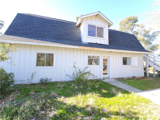 23699 Mclane Ave, Corning, CA 96021 - view of front facade with a shingled roof, board and batten siding, and a front yard