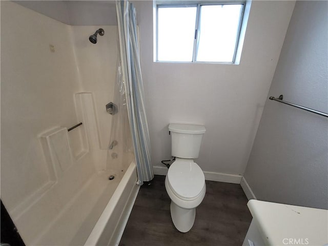 23699 Mclane Ave, Corning, CA 96021 - bathroom with wood finished floors, toilet, baseboards, and shower / bath combination with curtain