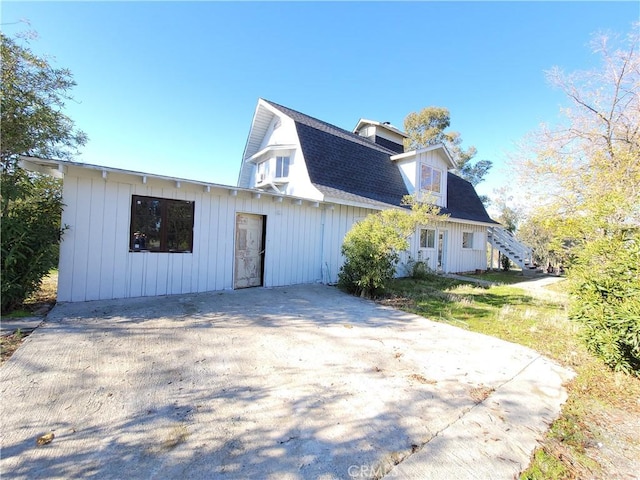 23699 Mclane Ave, Corning, CA 96021 - view of home's exterior with stairs and roof with shingles