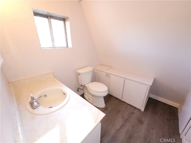 23699 Mclane Ave, Corning, CA 96021 - bathroom with wood finished floors, vanity, and toilet