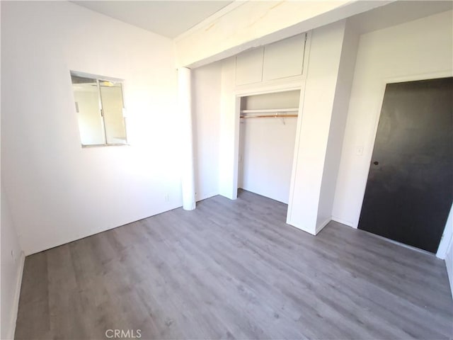 23699 Mclane Ave, Corning, CA 96021 - unfurnished bedroom featuring wood finished floors and a closet