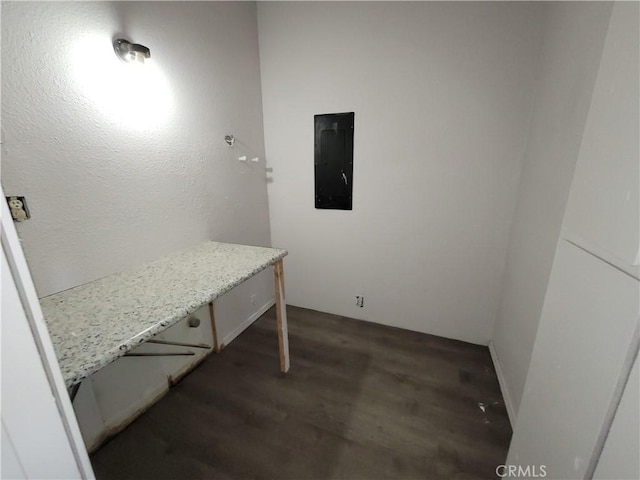23699 Mclane Ave, Corning, CA 96021 - home office with electric panel and dark wood finished floors
