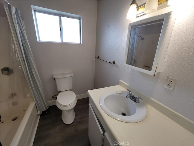 23699 Mclane Ave, Corning, CA 96021 - full bath featuring wood finished floors, toilet, vanity, and shower / bath combination with curtain