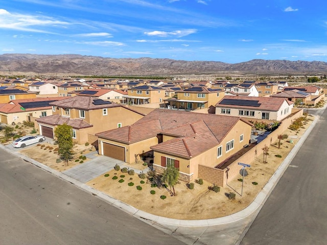 birds eye view of property featuring a mountain view