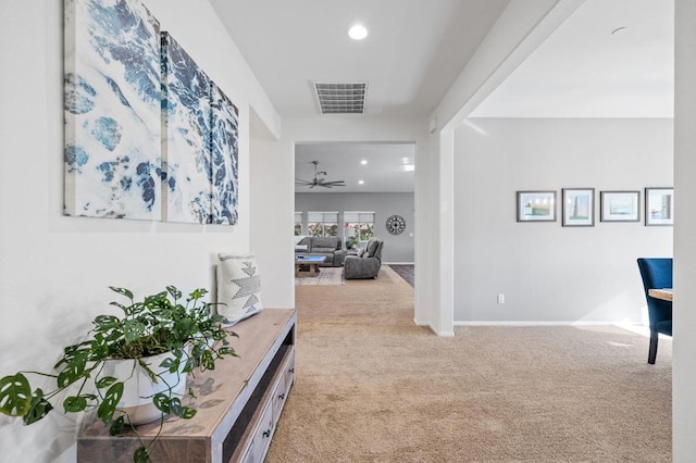 hallway featuring carpet