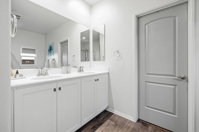 bathroom with hardwood / wood-style flooring and vanity