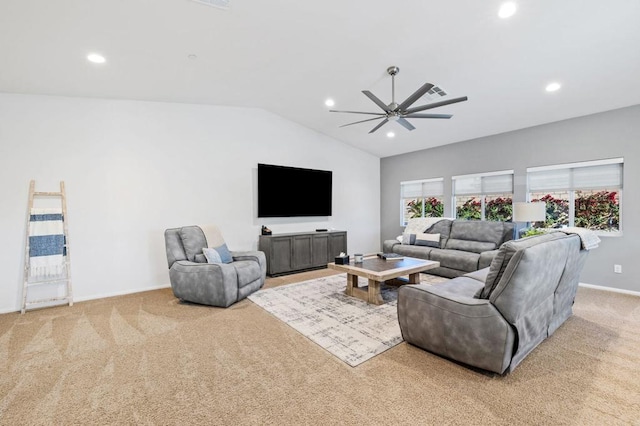 carpeted living room featuring ceiling fan and lofted ceiling