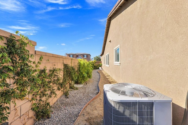 view of yard with central air condition unit