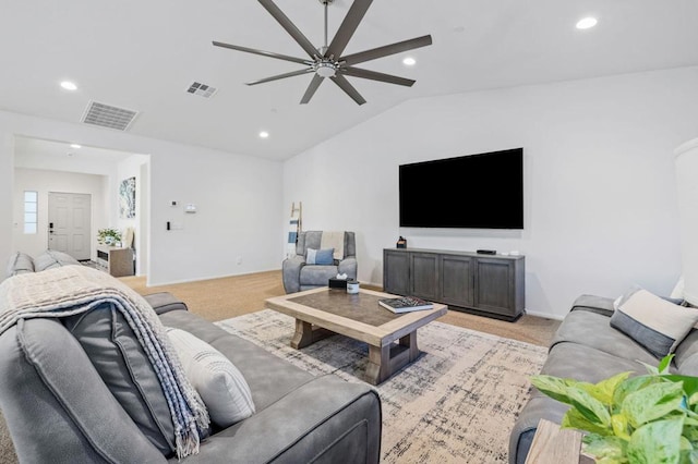 living room with light carpet, ceiling fan, and vaulted ceiling