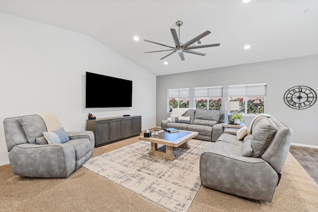 carpeted living room with vaulted ceiling and ceiling fan