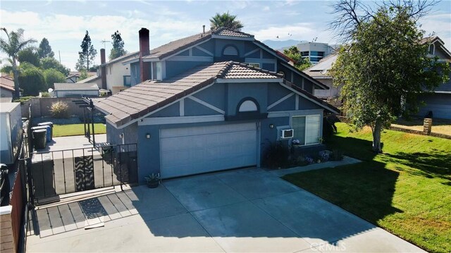 view of front of home featuring a garage and a front yard