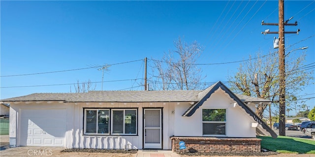 single story home featuring a garage