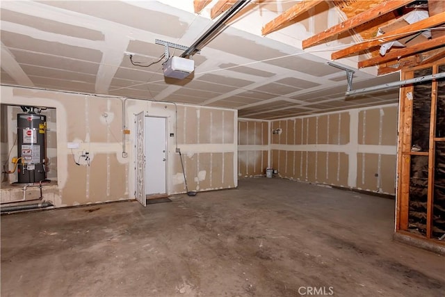 garage with water heater and a garage door opener