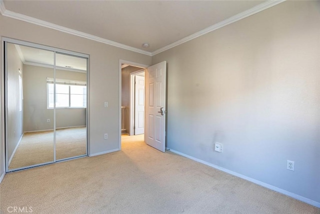 unfurnished bedroom featuring light carpet, a closet, and ornamental molding