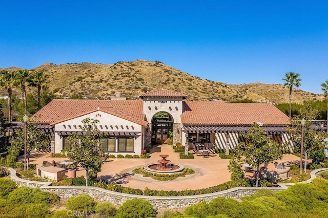 view of front of house with a mountain view