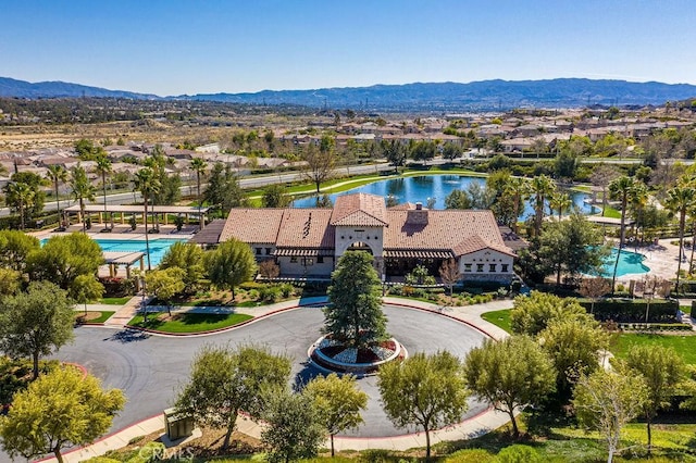 birds eye view of property featuring a water and mountain view