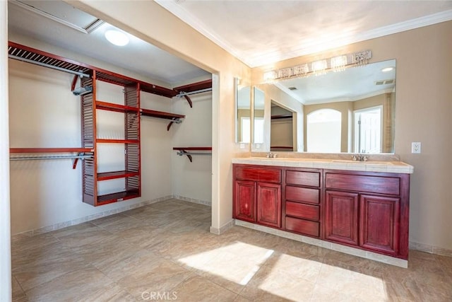 bathroom with vanity and crown molding