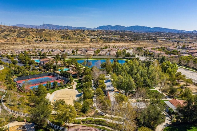 aerial view featuring a water and mountain view