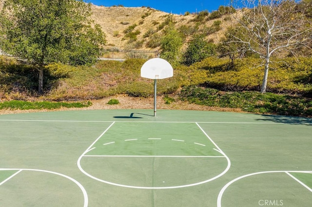 view of basketball court featuring a mountain view