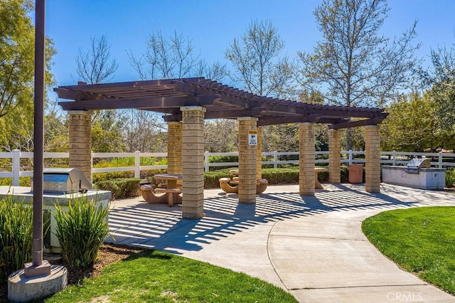 view of patio / terrace featuring area for grilling and a pergola