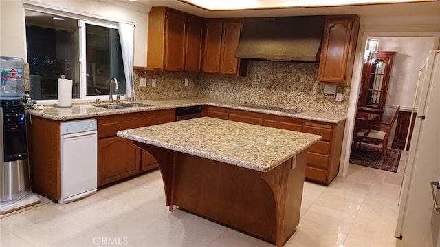 kitchen with decorative backsplash, black electric stovetop, sink, wall chimney range hood, and a center island